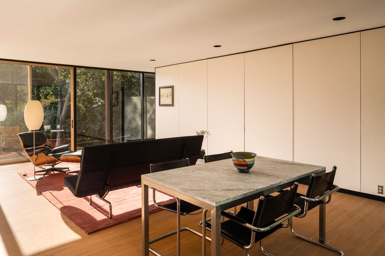 Sliding panels conceal the kitchen from the den