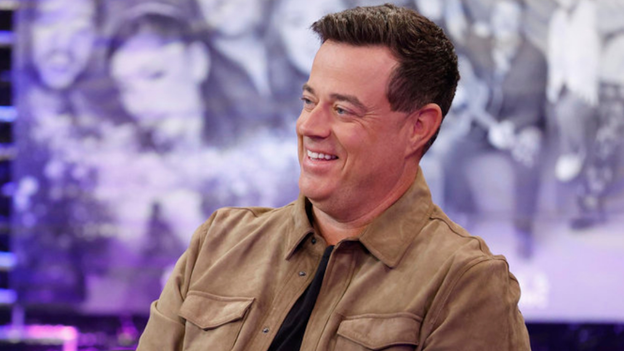 Carson Daly is shown on The Voice.
