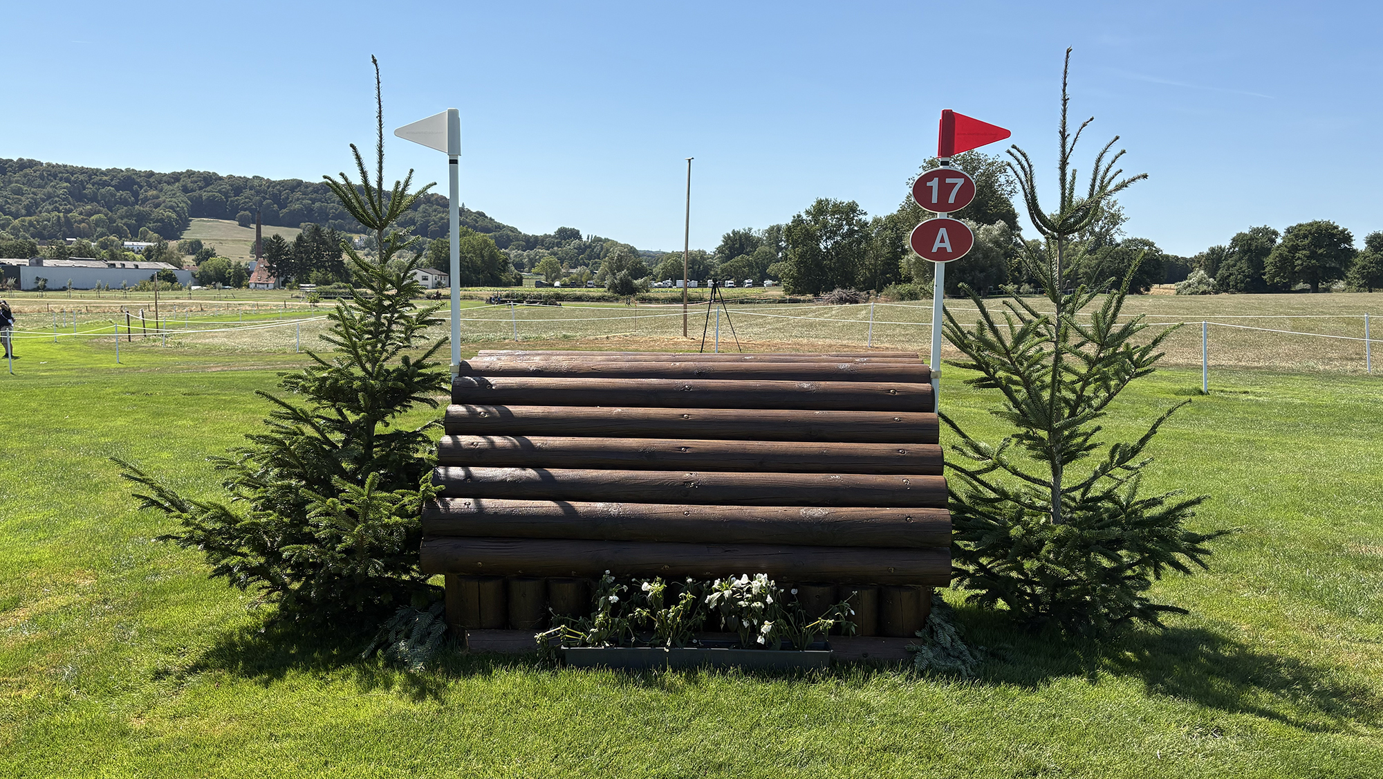 A narrow wooden cabin fence on the Aachen eventing World Championships cross-country course