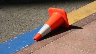 Stricken cone lying upon its side