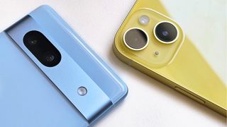 A closeup of the camera on the blue Google Pixel 7a on the left and a yellow iPhone 14 on the right