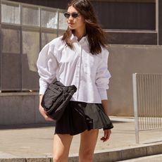 woman wearing shirt and skirt