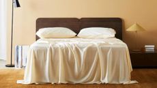 Ettitude bamboo bedding in butter yellow photographed in a similarly shaded yellow-tinged bedroom