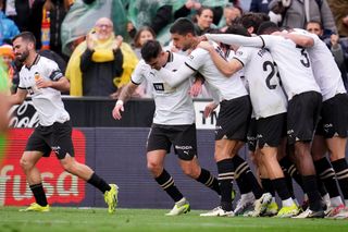 Valencia players celebrate a goal against Getafe at Mestalla in March 2024.