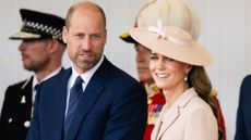 Prince William, Prince of Wales and Catherine, Princess of Wales smile as they stand on the Royal Dais at Datchet Road on July 08, 2025