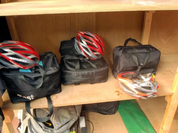 Riders' rainwear and helmets are kept well organised by team staff