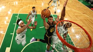 Stephen Curry #30 of the Golden State Warriors drives to the basket against Derrick White #9 and Al Horford #42 of the Boston Celtics in the first half during Game Four of the 2022 NBA Finals at TD Garden on June 10, 2022 in Boston, Massachusetts.