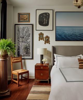 bedroom ideas with a gallery wall of art hung above the bed