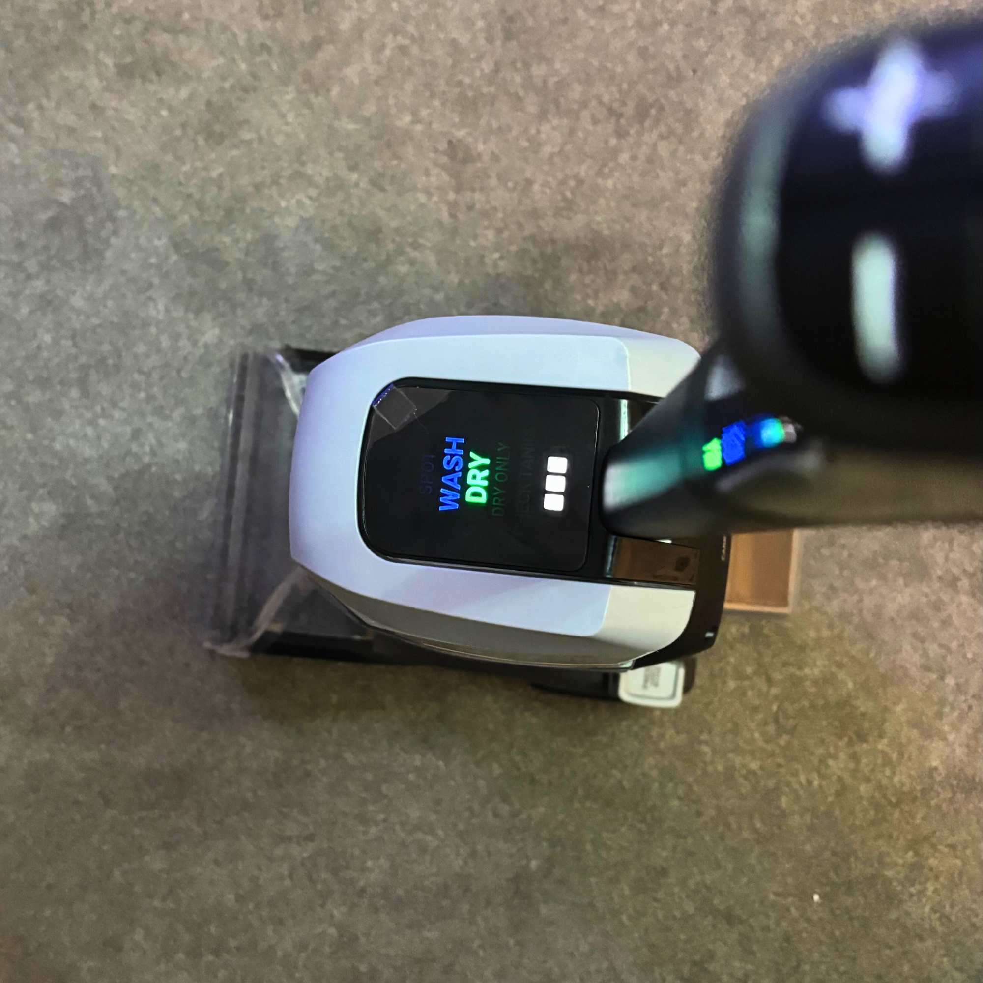 LED display of the ONEPWR Cordless Compact Carpet Cleaner in WASH DRY mode