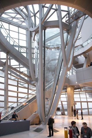 The generously-glazed, light-filled Crystal acts both as the museum lobby and a covered public space, pitched as a  vibrant meeting place set to attract all kinds of visitors. The Gravity Well supporting this 33m high structure makes its roof look like an enormous whirlpool of steel and glass