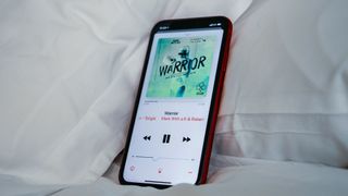 An iPhone XR playing music