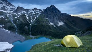 How to choose a backpacking tent: tent overlooking small lake