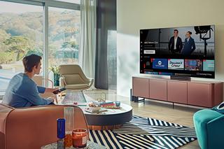 Man sitting in home watching TV