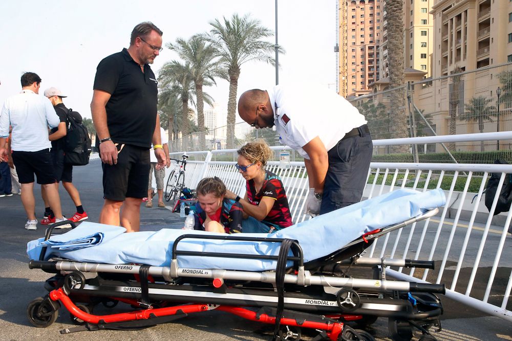 Medical personnel attend to Alena Amialiusik (Canyon SRAM Racing) after the Worlds TTT