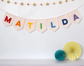 Personalized gifts for babies illustrated by bunting