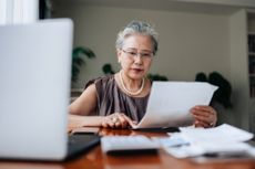 A woman managing personal banking and finance at home