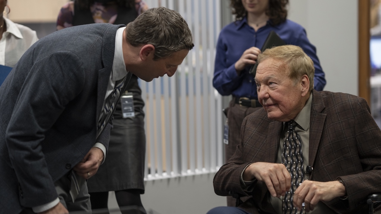 Ron talking to Douglas in wheelchair in The Chair Company