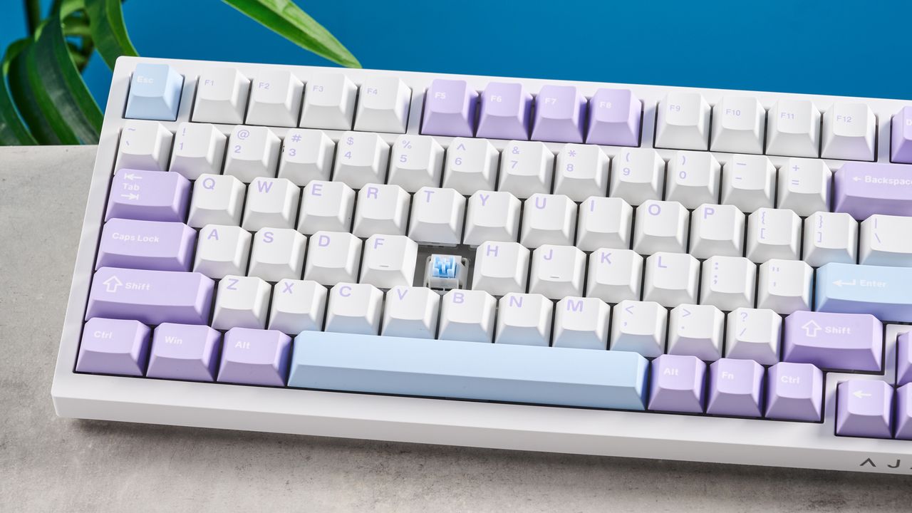 A white and purple Epomaker Ajazz AK820 Pro mechanical keyboard