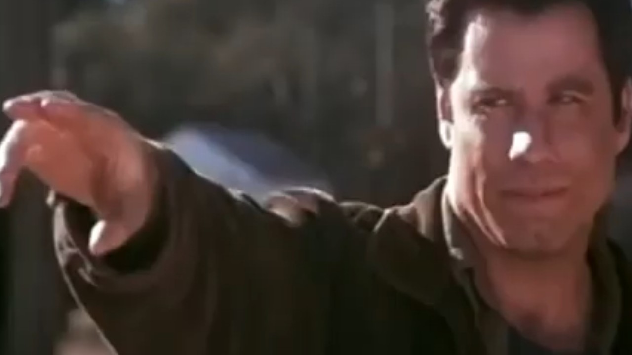 John Travolta with his arm extended in Phenomenon