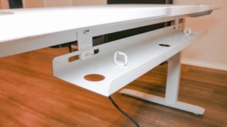 The cable management tray for the ApexDesk Elite Series 60