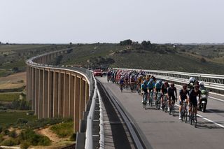 AGRIGENTO ITALY OCTOBER 04 Rohan Dennis of Australia and Team INEOS Grenadiers Salvatore Puccio of Italy and Team INEOS Grenadiers Jonathan Castroviejo of Spain and Team INEOS Grenadiers Jakob Fuglsang of Denmark and Astana Pro Team Tao Geoghegan Hart of The United Kingdom and Team INEOS Grenadiers Bridge Landscape Peloton during the 103rd Giro dItalia 2020 Stage 2 a 149km stage from Alcamo to Agrigento 243m girodiitalia Giro on October 04 2020 in Agrigento Italy Photo by Tim de WaeleGetty Images