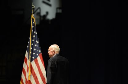 Sen. John McCain near an American Flag