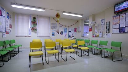An empty GP's waiting room in London