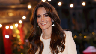 Britain's Catherine, Princess of Wales smiles as she arrives to attend the "Together At Christmas" Carol Service" at Westminster Abbey in London on December 8, 2023