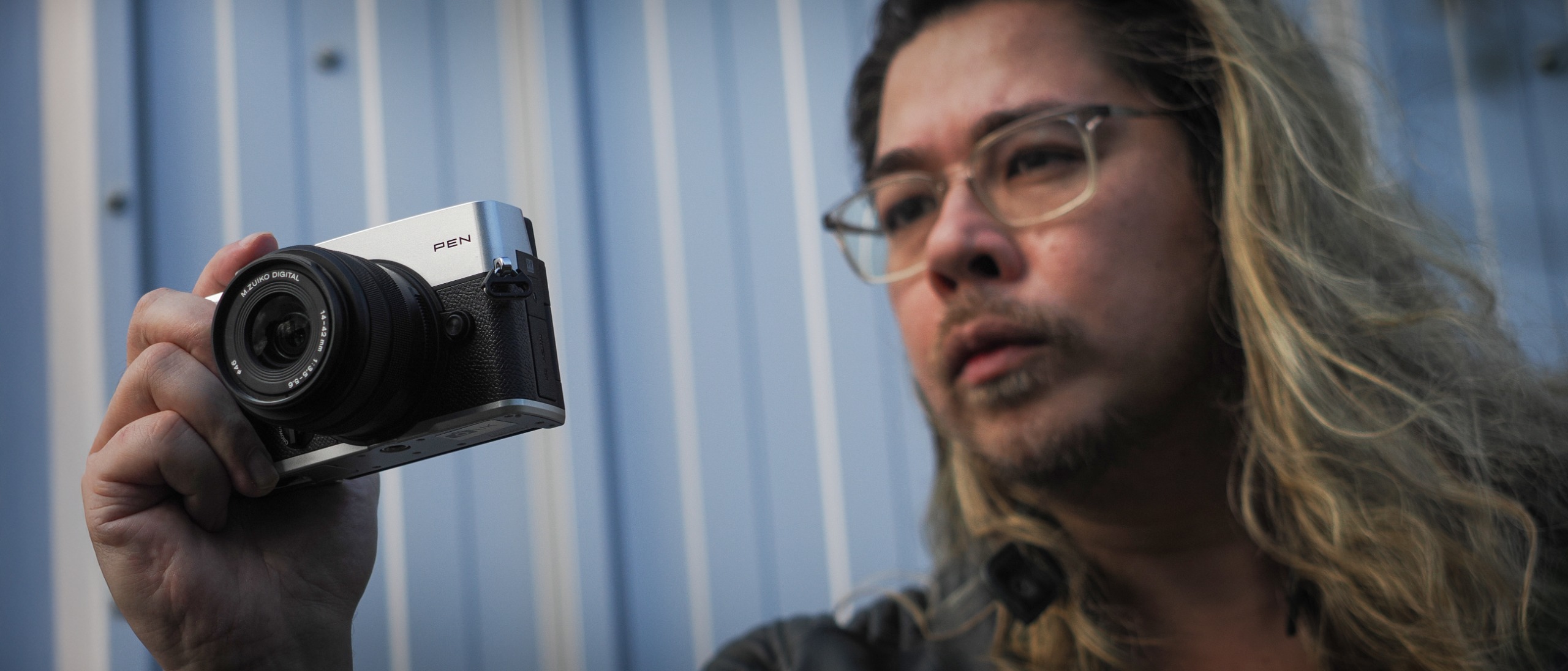 James Artaius shooting with the OM System PEN and the OM System M.Zuiko 14-42mm f/3.5-5.6 III in an urban setting