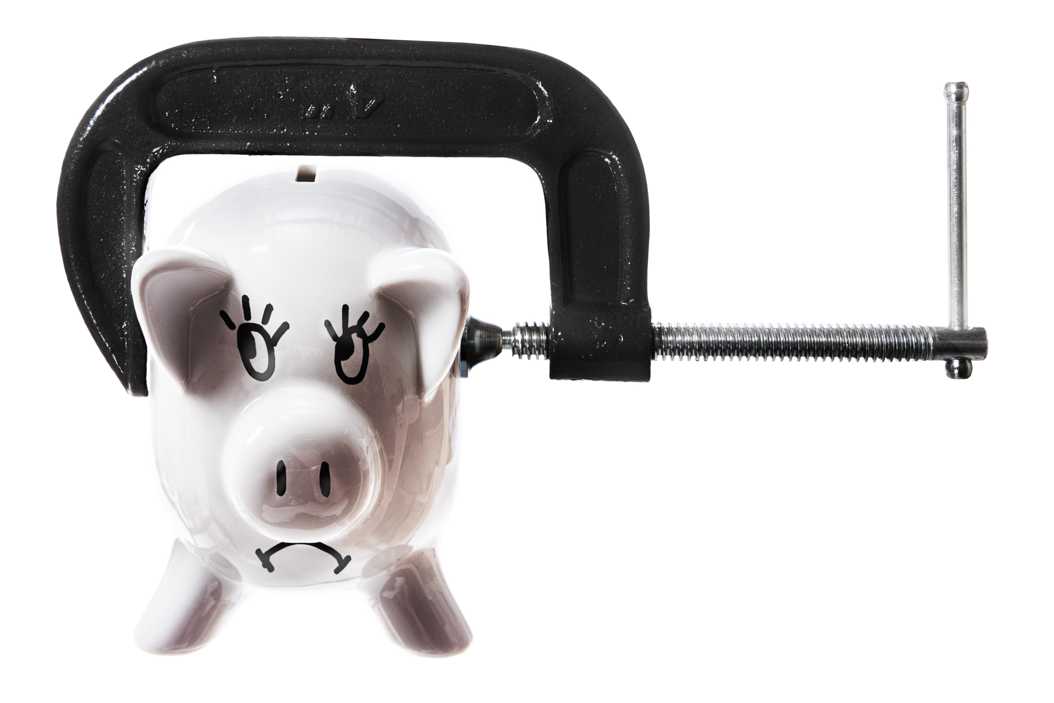 Clamp squashing an emaciated piggy bank. Concept shot for poverty, recession, bankruptcy, cash flow crisis, etc.