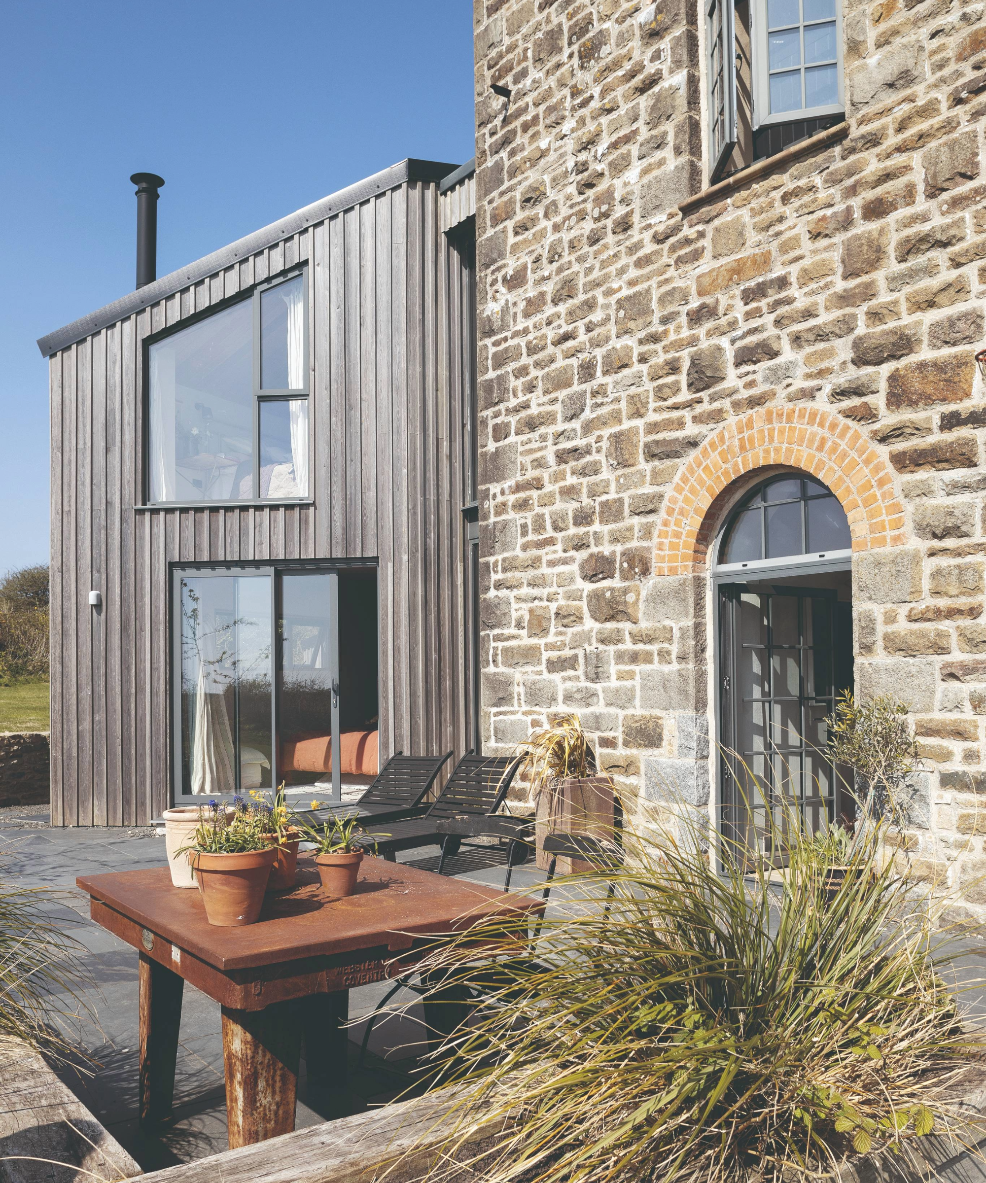 Exterior of the property with an outdoor seating area