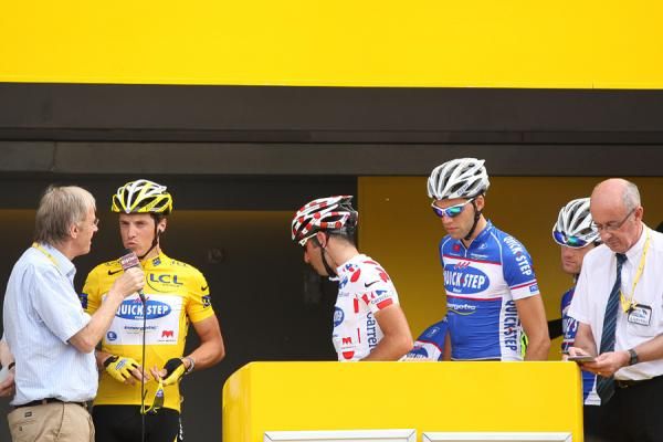 The Quick Step team of race leader Sylvain Chavanel signs in.