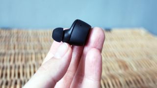 a closeup of one sennheiser cx true wireless earbud