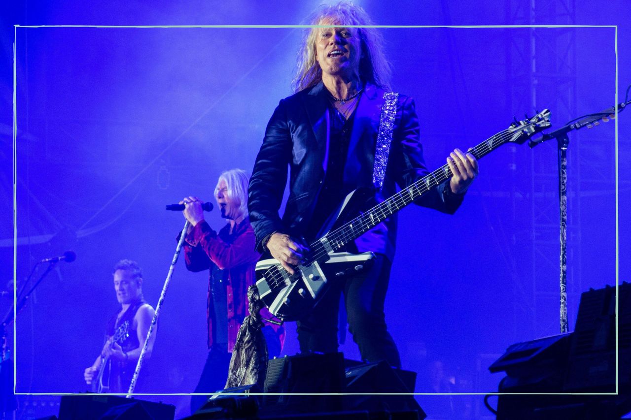 Rick Savage of the rock band Def Leppard performs live in concert at Petco Park during The Stadium Tour. 