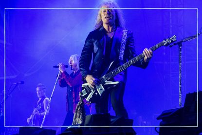 Rick Savage of the rock band Def Leppard performs live in concert at Petco Park during The Stadium Tour. 