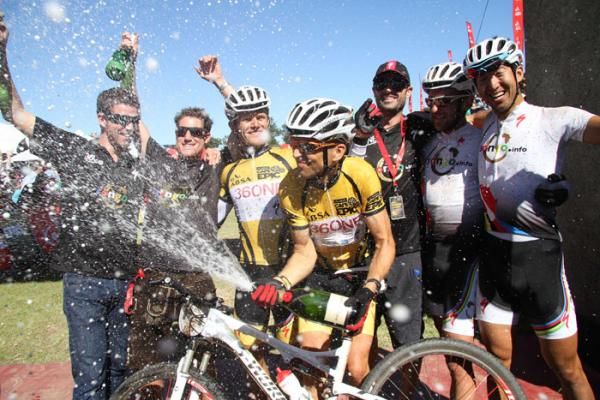 Christoph Sauser of 36One-Songo-Specialized sprays the champagne in celebration after winning the 2012 Cape Epic with Burry Stander