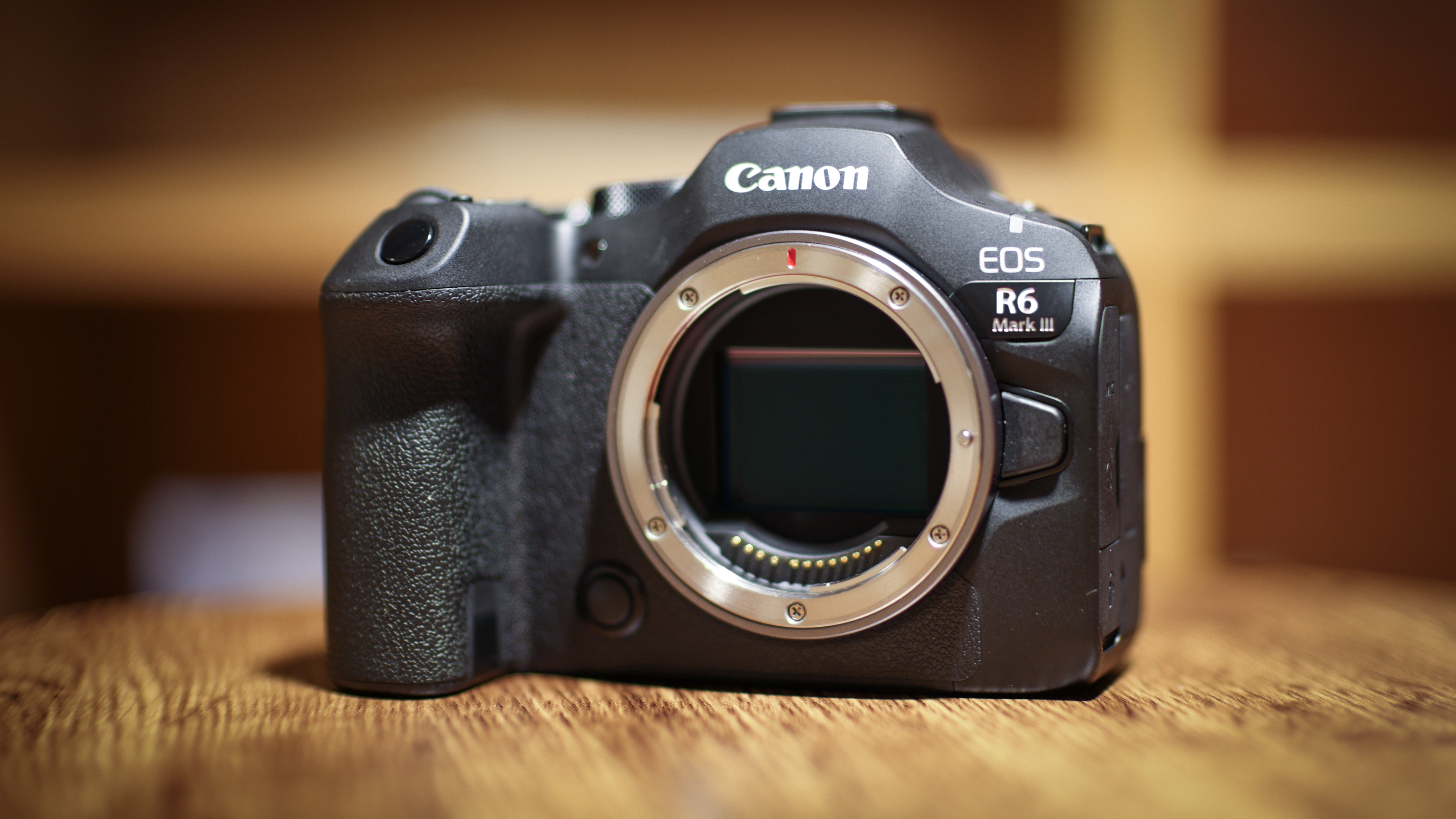 Canon EOS R6 Mark III against a wooden background