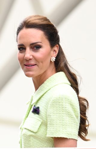 Kate's smoky eye and earrings were the focus, as her pulled up hair framed her face