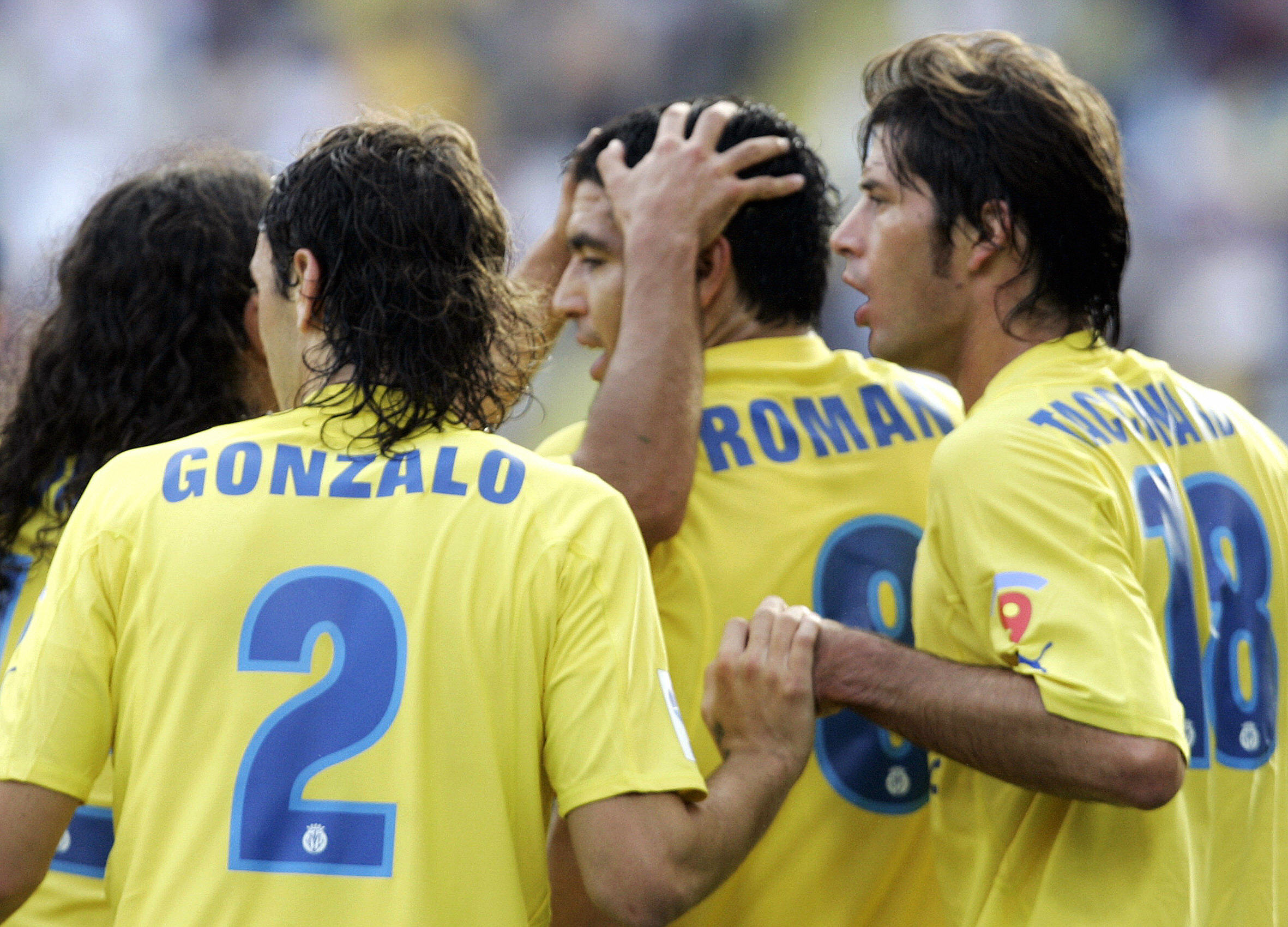 Juan Roman Riquelme celebrates with his Villarreal team-mates after scoring against Mallorca in October 2005.