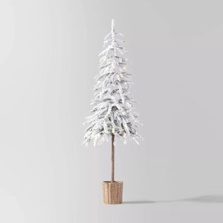 Pre-lit LED Dewdrop Downswept Flocked Balsam Fir against a gray background.