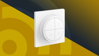 The Philips Hue Tap Dial Switch on a yellow background