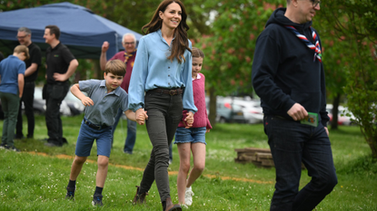 Prince Louis of Wales and Princess Charlotte of Wales walk with their mother, Catherine, Princess of Wales while taking part in the Big Help Out, during a visit to the 3rd Upton Scouts Hut in Slough on May 8, 2023 in London, England. The Big Help Out is a day when people are encouraged to volunteer in their communities. It is part of the celebrations of the Coronation of Charles III and his wife, Camilla, as King and Queen of the United Kingdom of Great Britain and Northern Ireland, and the other Commonwealth realms that took place at Westminster Abbey on Saturday, May 6, 2023.