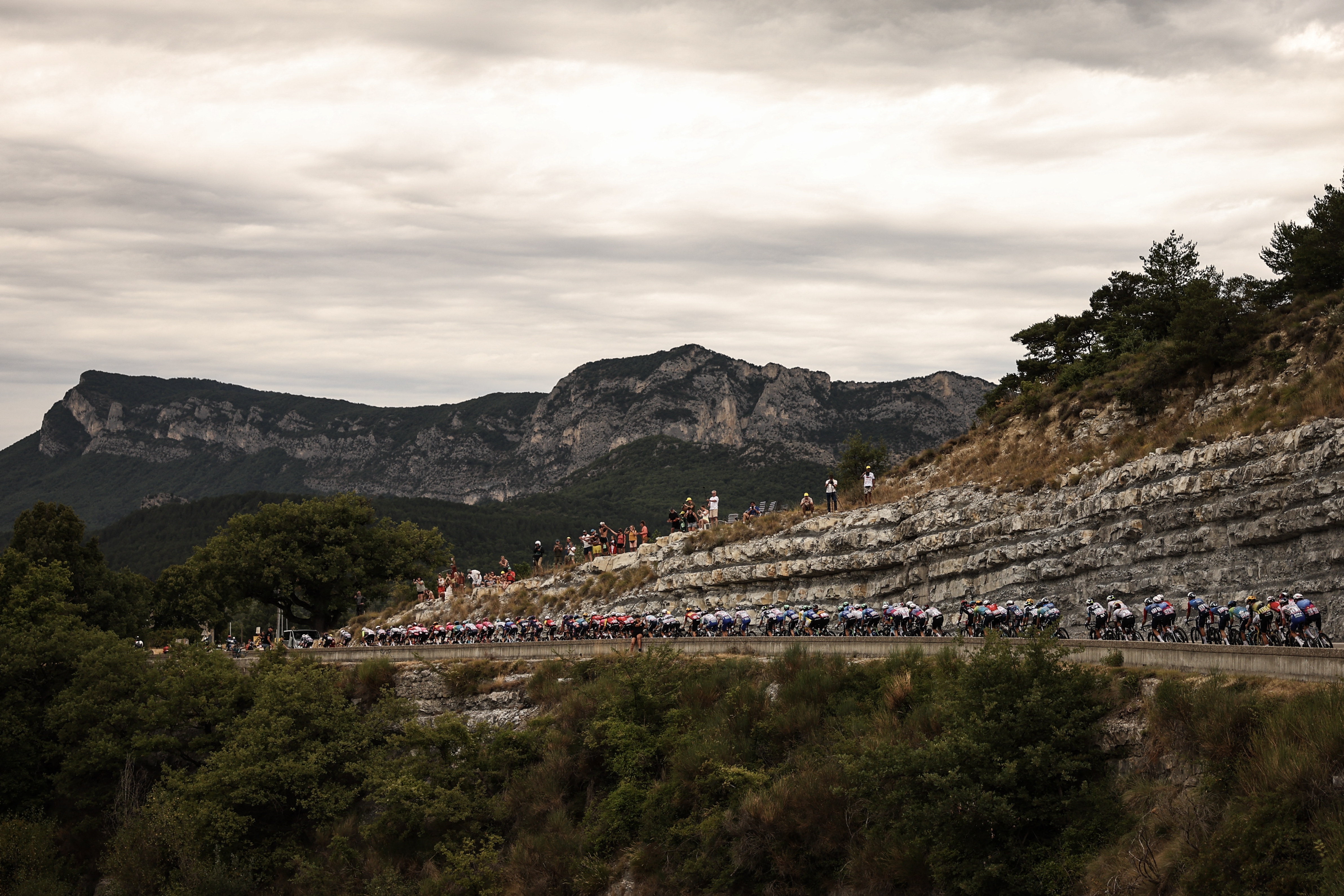 The pack of riders (peloton) cycles during the 17th stage of the 112th edition of the Tour de France cycling race, 160.4 km between Bollene and Valence, southern France, on July 23, 2025. (Photo by Anne-Christine POUJOULAT / AFP) (Photo by ANNE-CHRISTINE POUJOULAT/AFP via Getty Images)