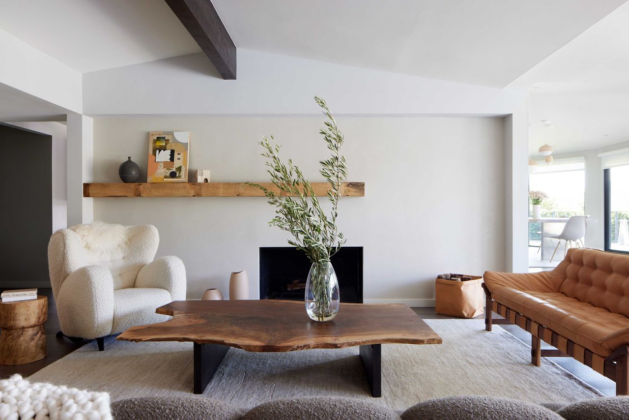 a living room with beige feature wall