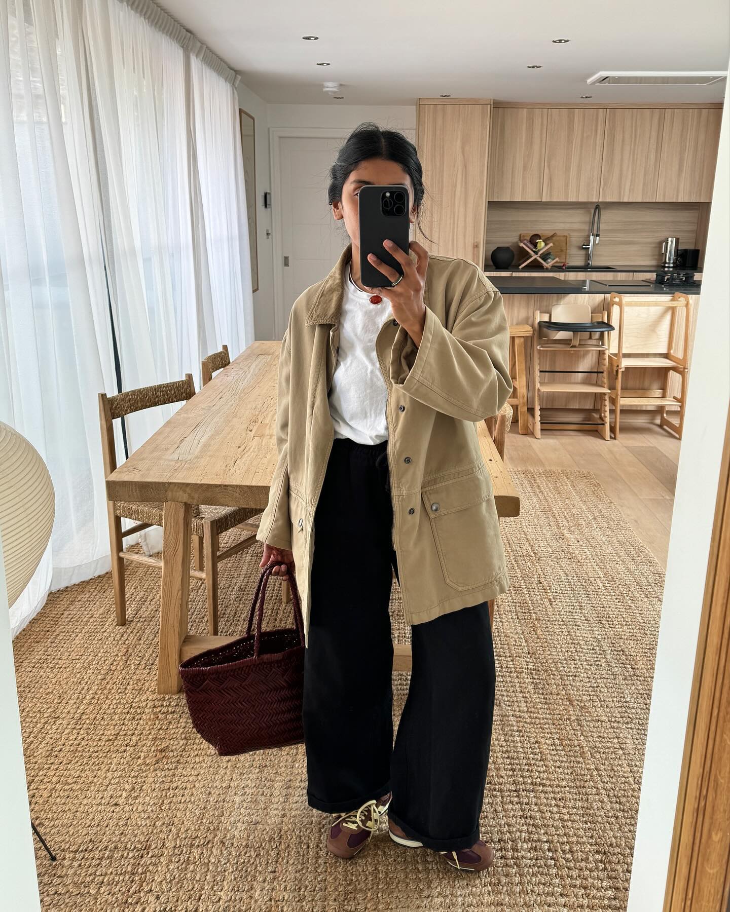 Monikh in an outfit with brown trainers
