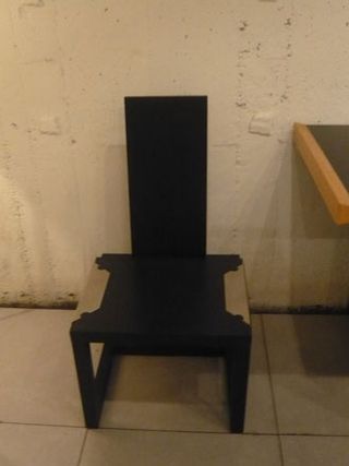 Dark, angular chair with slim backrest