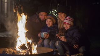 campfire safety: family in front of campfire