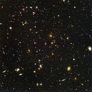 This view of nearly 10,000 galaxies is called the Hubble Ultra Deep Field. The snapshot includes galaxies of various ages, sizes, shapes, and colors. The smallest, reddest galaxies, about 100, may be among the most distant known, existing when the universe was just 800 million years old. The nearest galaxies--the larger, brighter, well-defined spirals and ellipticals--thrived about 1 billion years ago, when the cosmos was 13 billion years old.