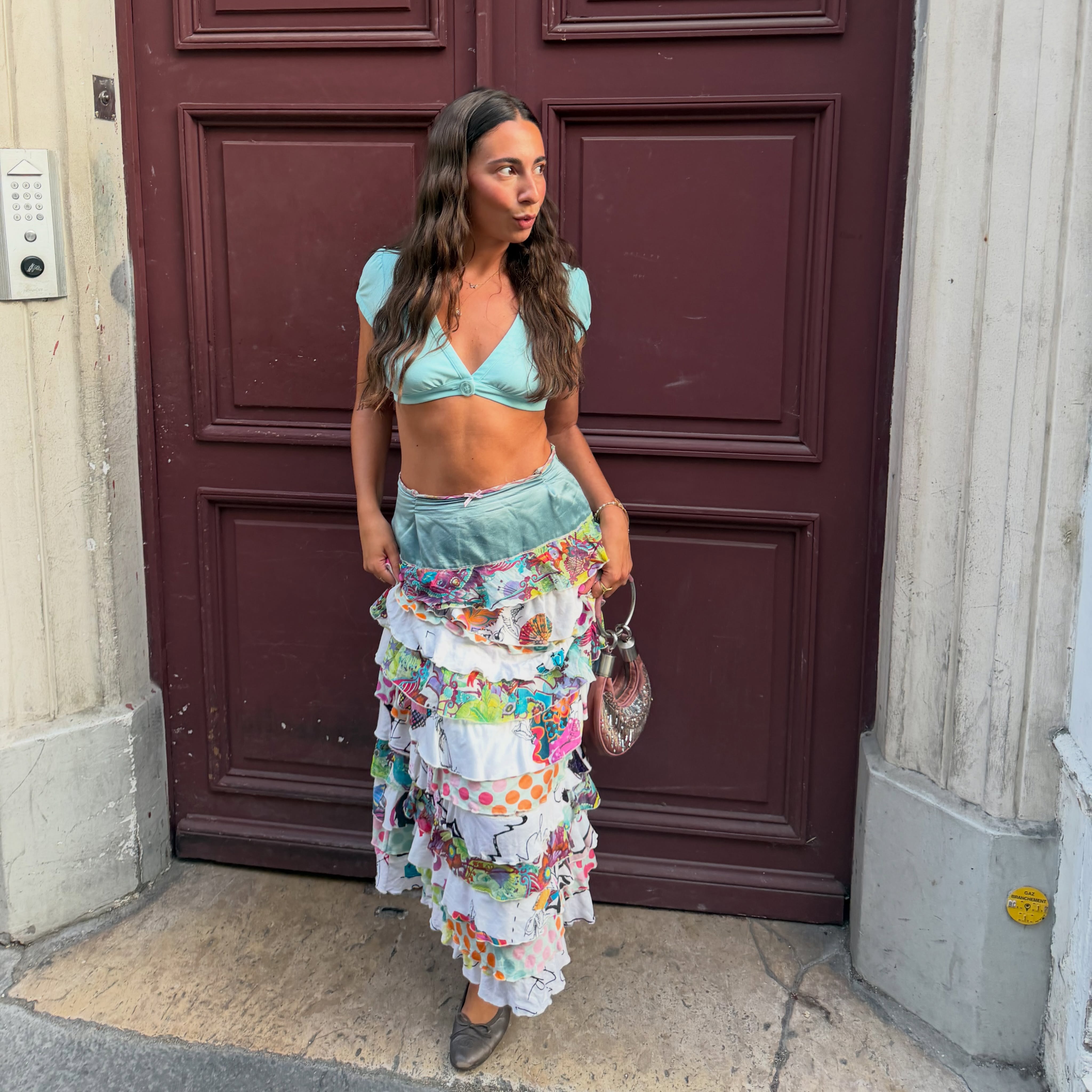 @stylewithsoco wearing the tiered ruffle skirt trend