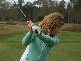 PGA Pro Katie Dawkins with a straight left arm at the top of her backswing